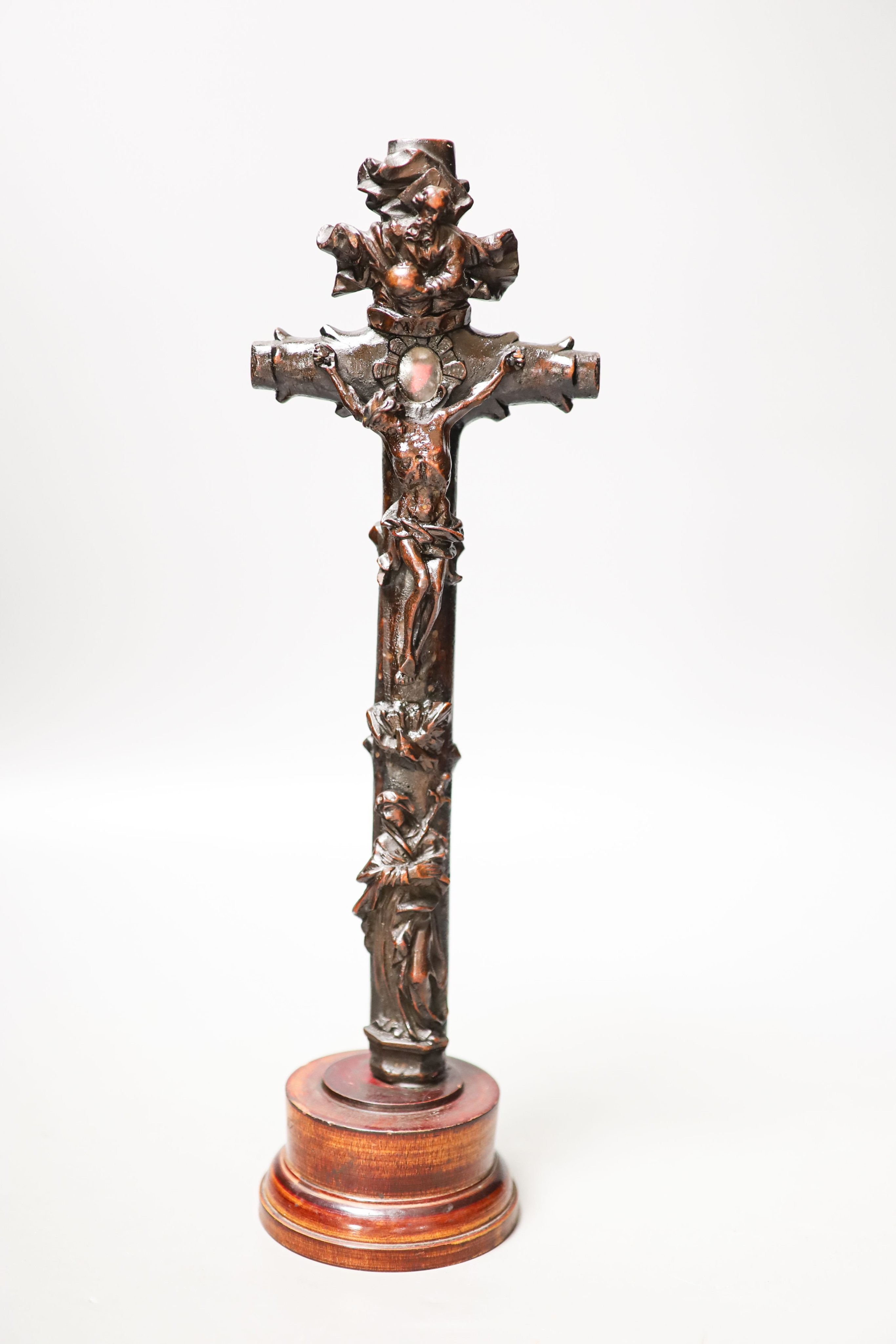 A carved wood crucifix 33cm